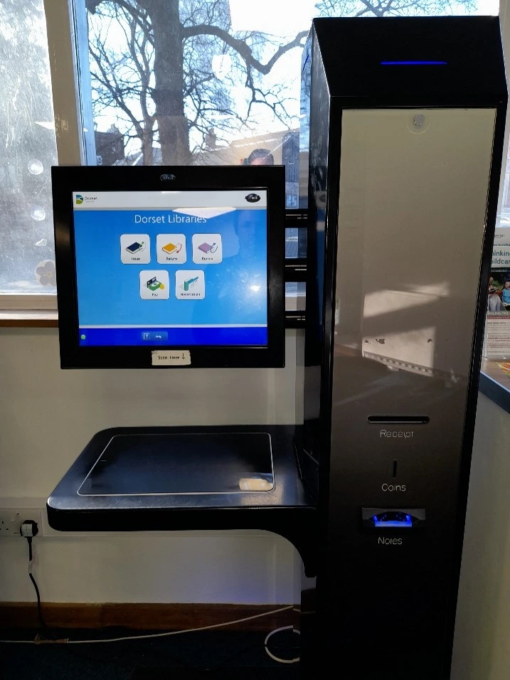 This is a picture of a library self service machine.
