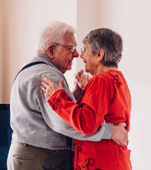 Two people holding hands and dancing together