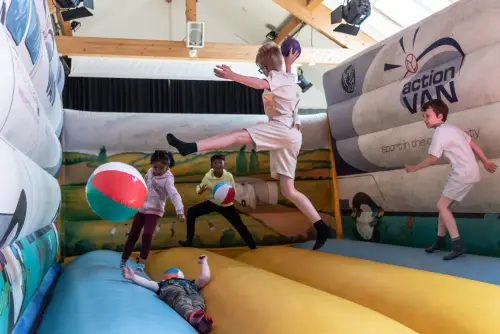 Children playing in the bouncy castle.