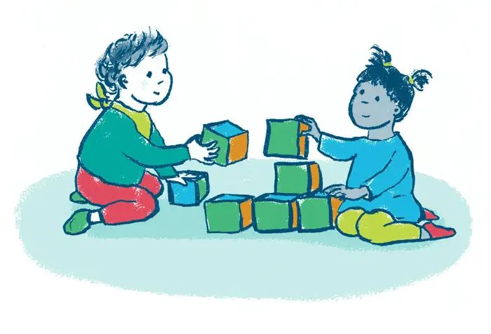 2 children playing with building blocks.