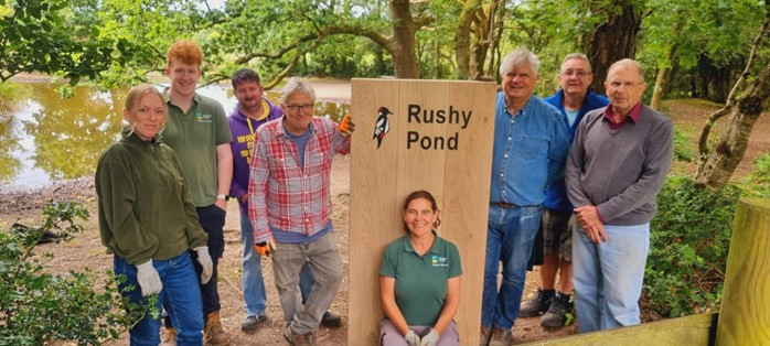 a wooden plinth with Rushy Pond on it