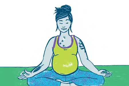 Pregnant woman doing yoga.