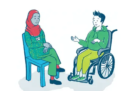 Two people chatting. One is sat in a wheelchair.